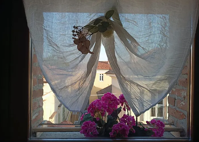 Апартаменты La Mansardina Di Sabrina Busca